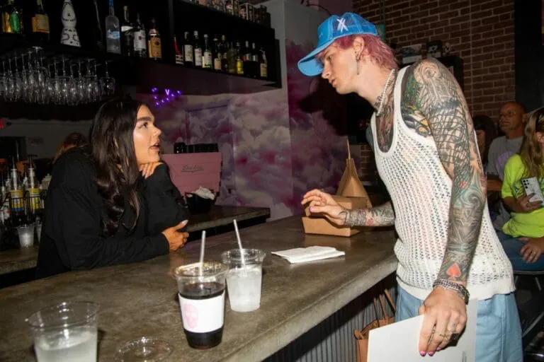 People gathered at a coffee shop, talking and connecting