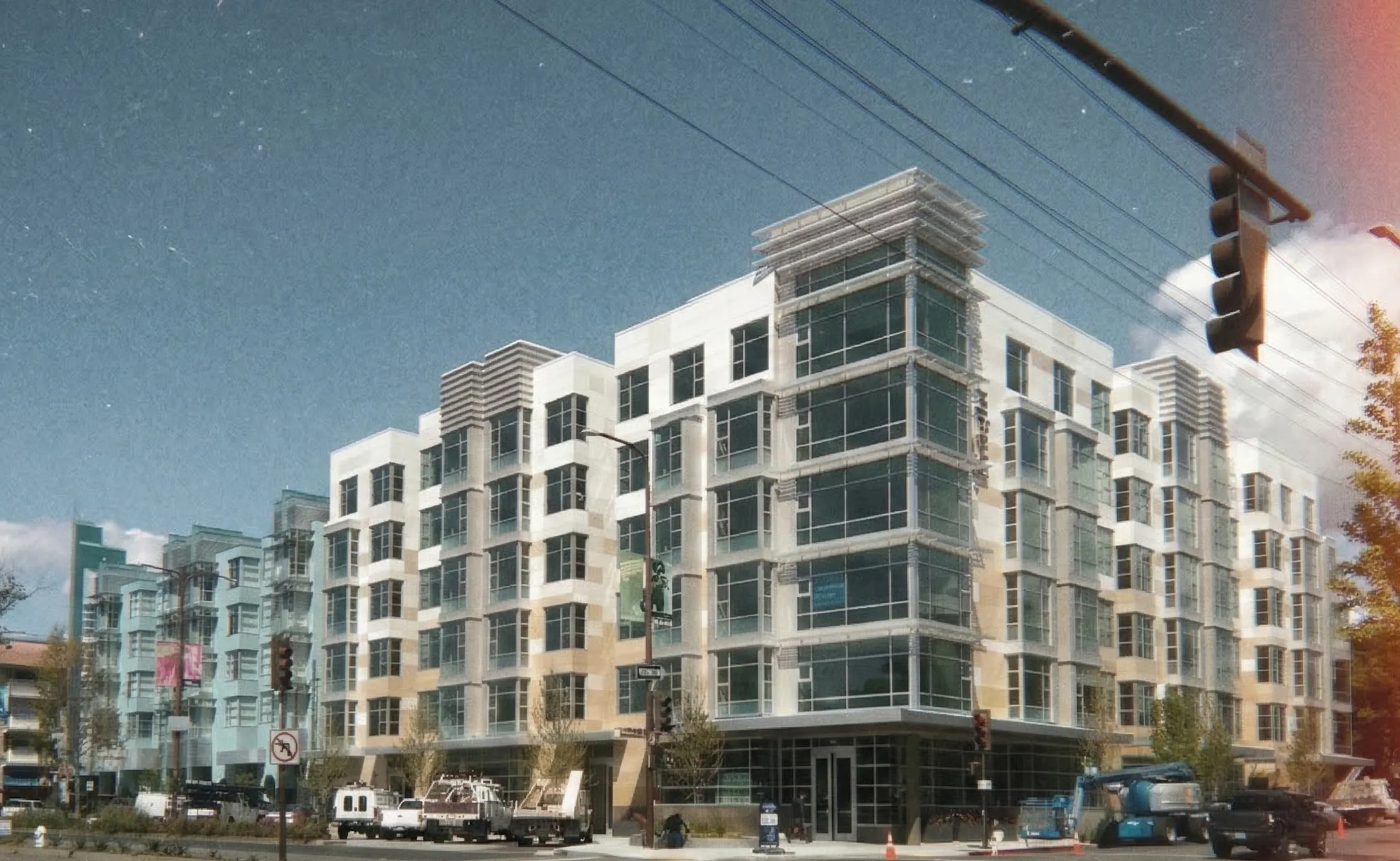 A five-over-one apartment building — the same luxury box going up in every city