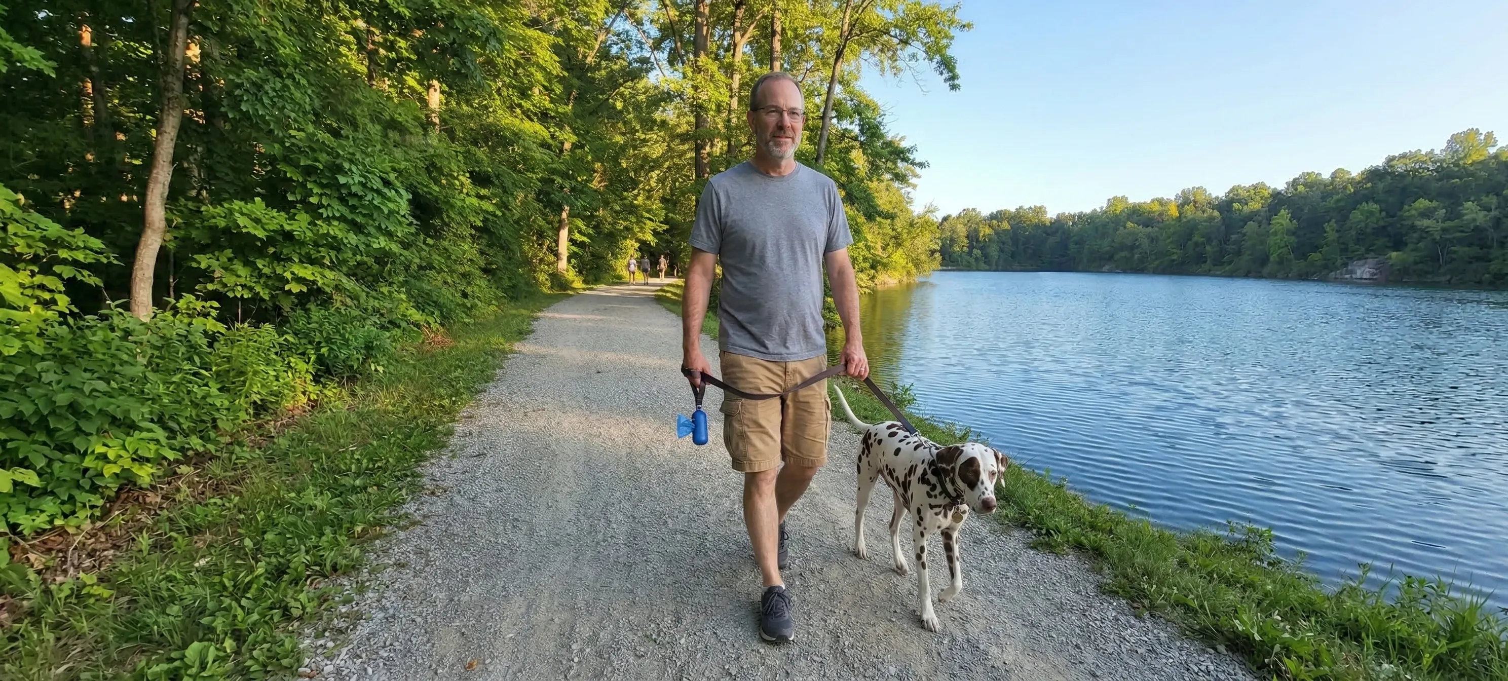 Ned Ludd walking with his dog Cyber through the Antrim neighborhood